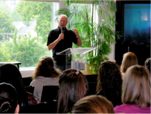 Ken Mansfield teaching Mercy residents during one of his many visits to the Nashville home