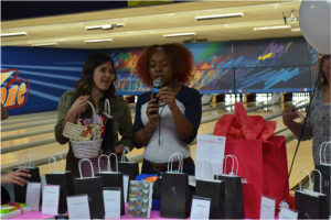 Mercy Development Director Lauren Hobar and Mercy grad Francis presented Bowl for Mercy awards